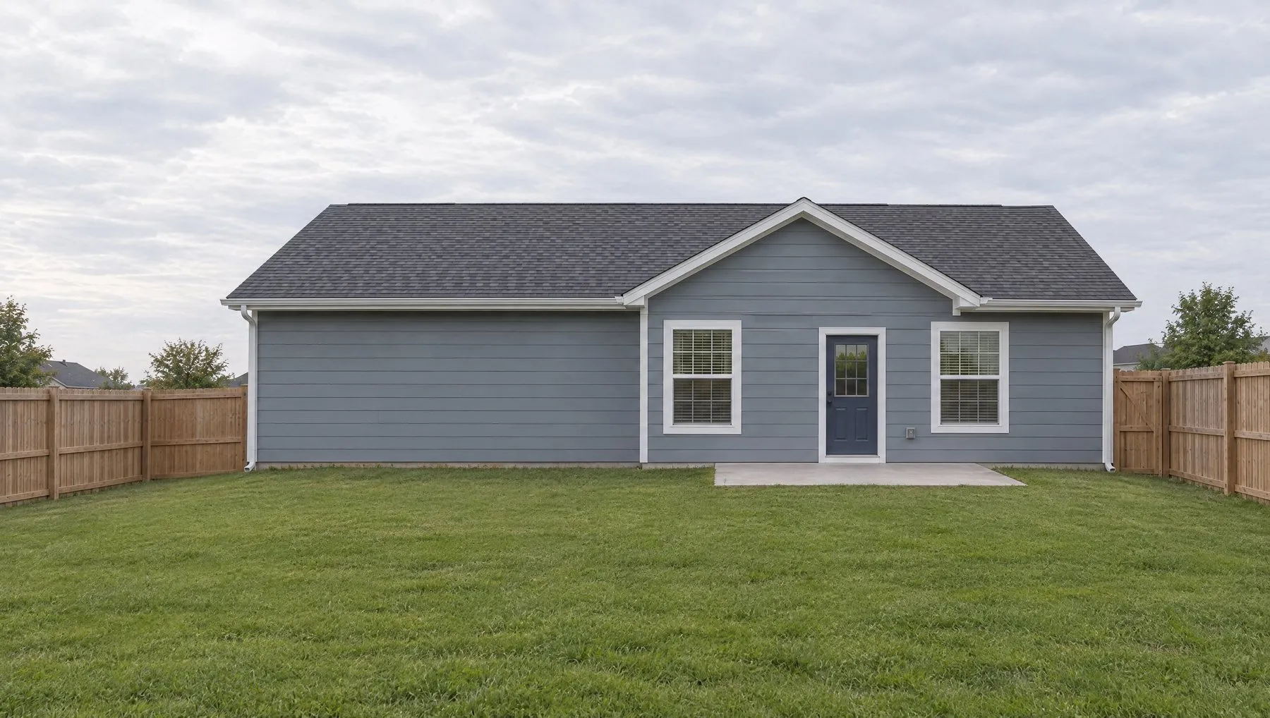 Back of the fictional house before the addition: plain siding on the left of the rear wall.