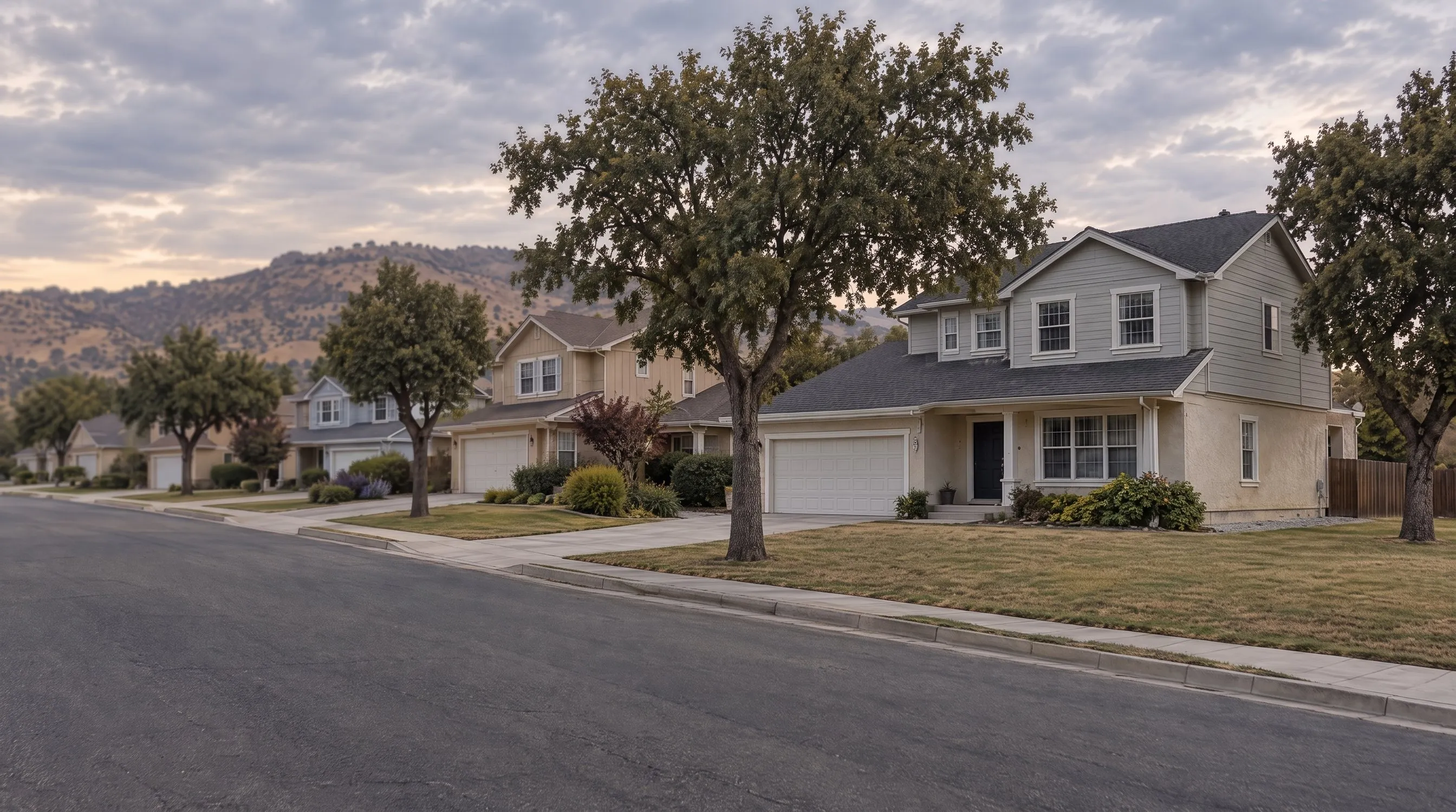 The street of houses with the three nearest in focus and the farther houses softly blurred.